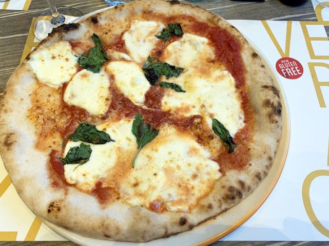 pizza with balls of melted mozzarella on top