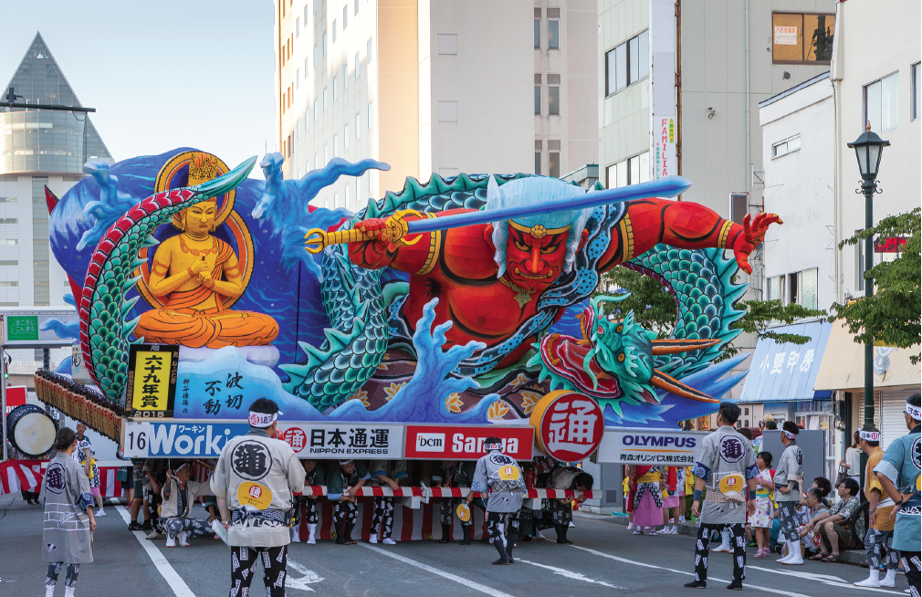 a large float being carried at the Nebuta Matsuri in Japan