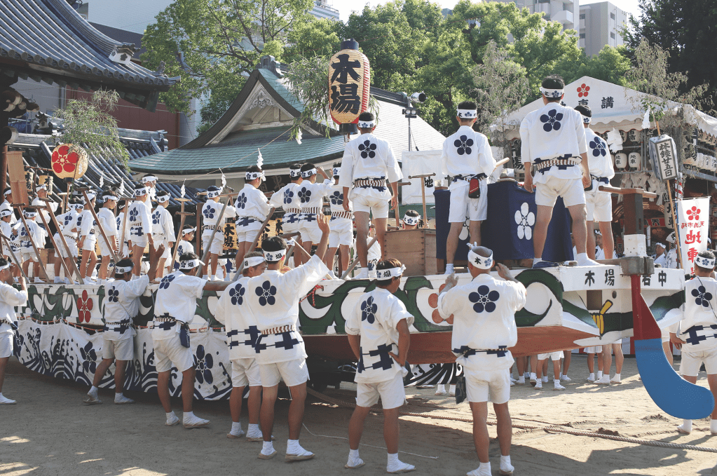 performers on a float at the Tenjin Matsuri in Osaka Japan