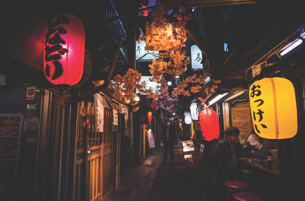 view of lanterns hanging outside of restaurant doorways at night Yakitori Alley