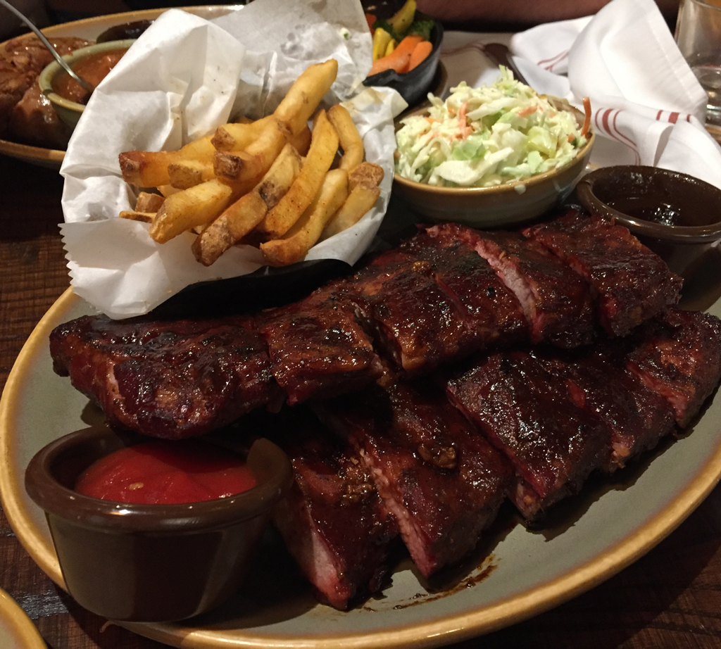 photo of bbq ribs, french fries, and cole slaw