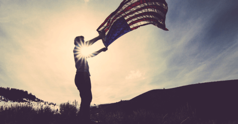 man waving american flag