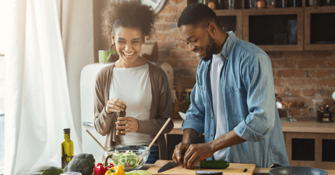 couple cooking at a table