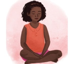 a child sitting cross-legged with their eyes closed