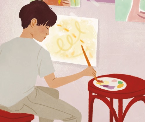 a child sitting at an easel dipping a paintbrush against a palette
