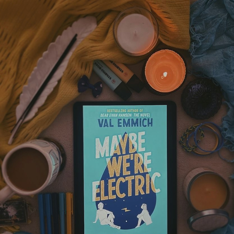NOVL - Instagram image of book cover for 'Maybe We're Electric' by Val Emmich