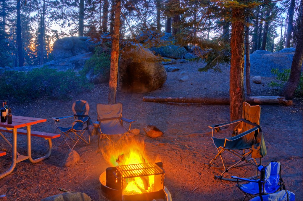 chairs around a campfire at night in Kings Canyon