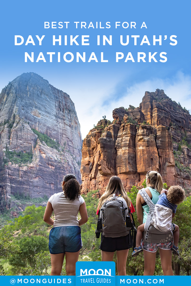 pinterest graphic depicting three hikers looking up at gigantic rock formations in utah with overlaid text reading day hike in utah's national parks