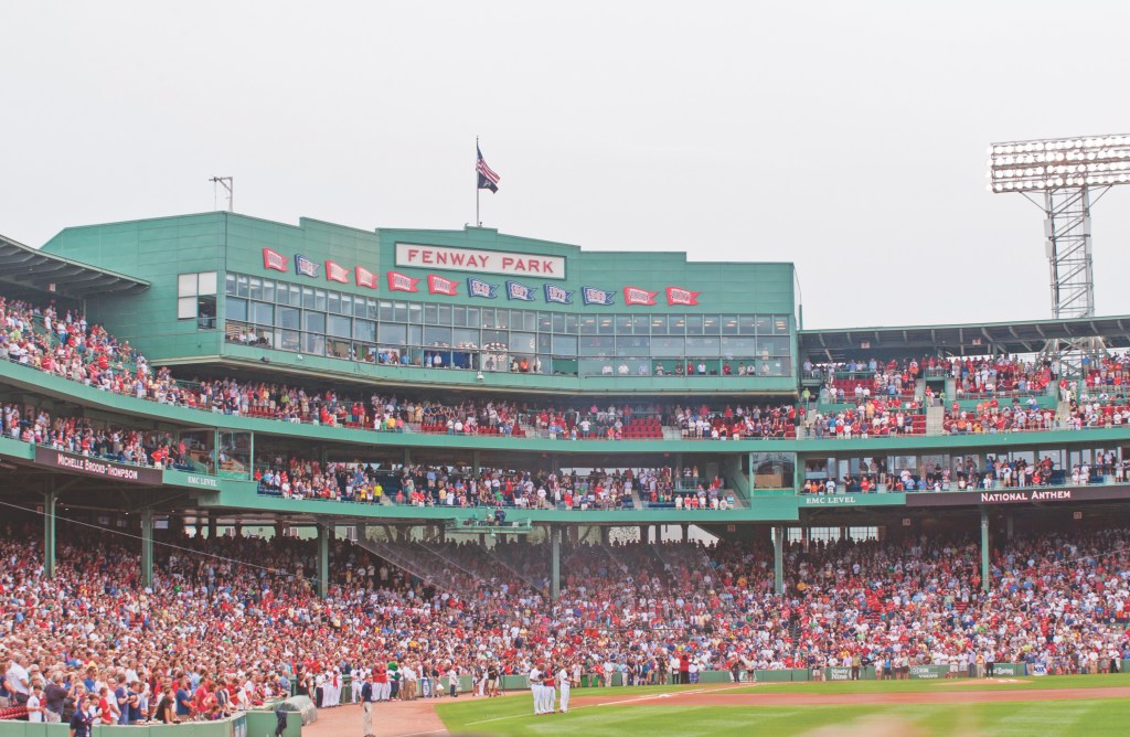 Crowded seats on a cloudy day Fenway Park