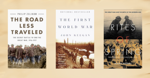 3 WWI Books on top of a brown scroll picture