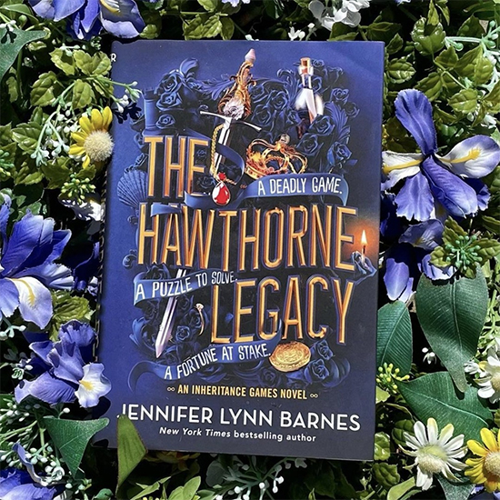 NOVL - Instagram image of a copy of 'The Hawthorne Legacy' book laying over flowers
