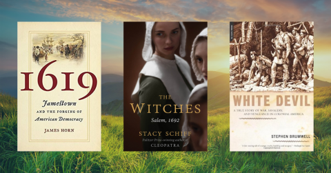 Three Books About the History of America on A Background with Mountains and Grass