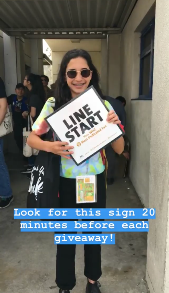 NOVL - Image of person holding up a sign for a giveaway