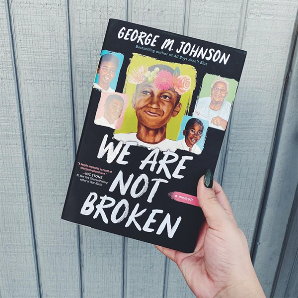 NOVL - Instagram image of hand holding up the book cover for 'We Are Not Broken' by George M. Johnson