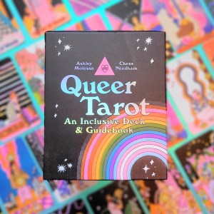 Photo of "Queer Tarot" laid above face-up cards from the deck