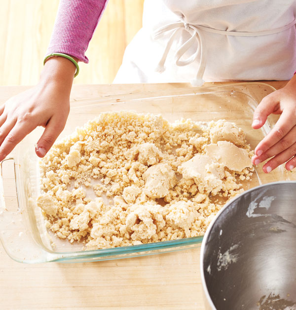 Photo of dough for the crust in a baking dish.