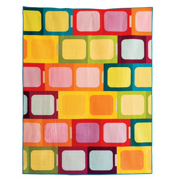 Photo of a "Cinderblocks" quilt in bright colors.