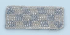 Photo of a blue and white checkered bead knit rectangle. 