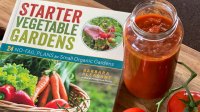 A photo of the Starter Vegetable Gardens book with a jar of sauce and tomatoes.