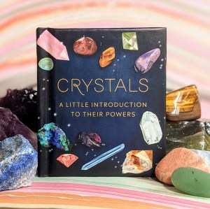 Photo of "Crystals" standing surrounded by various crystals