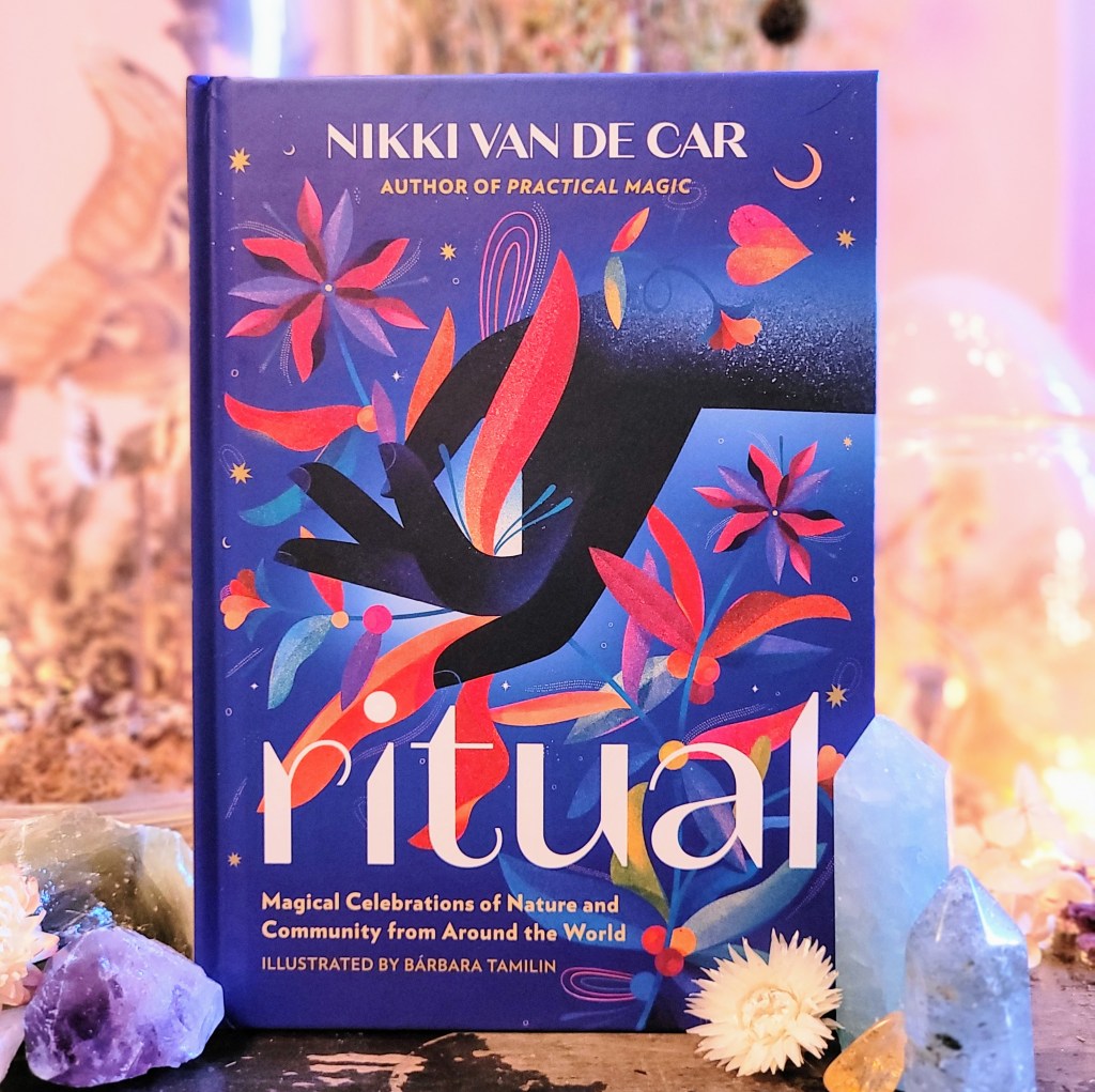 Photo of "Ritual" standing among flowers and crystals
