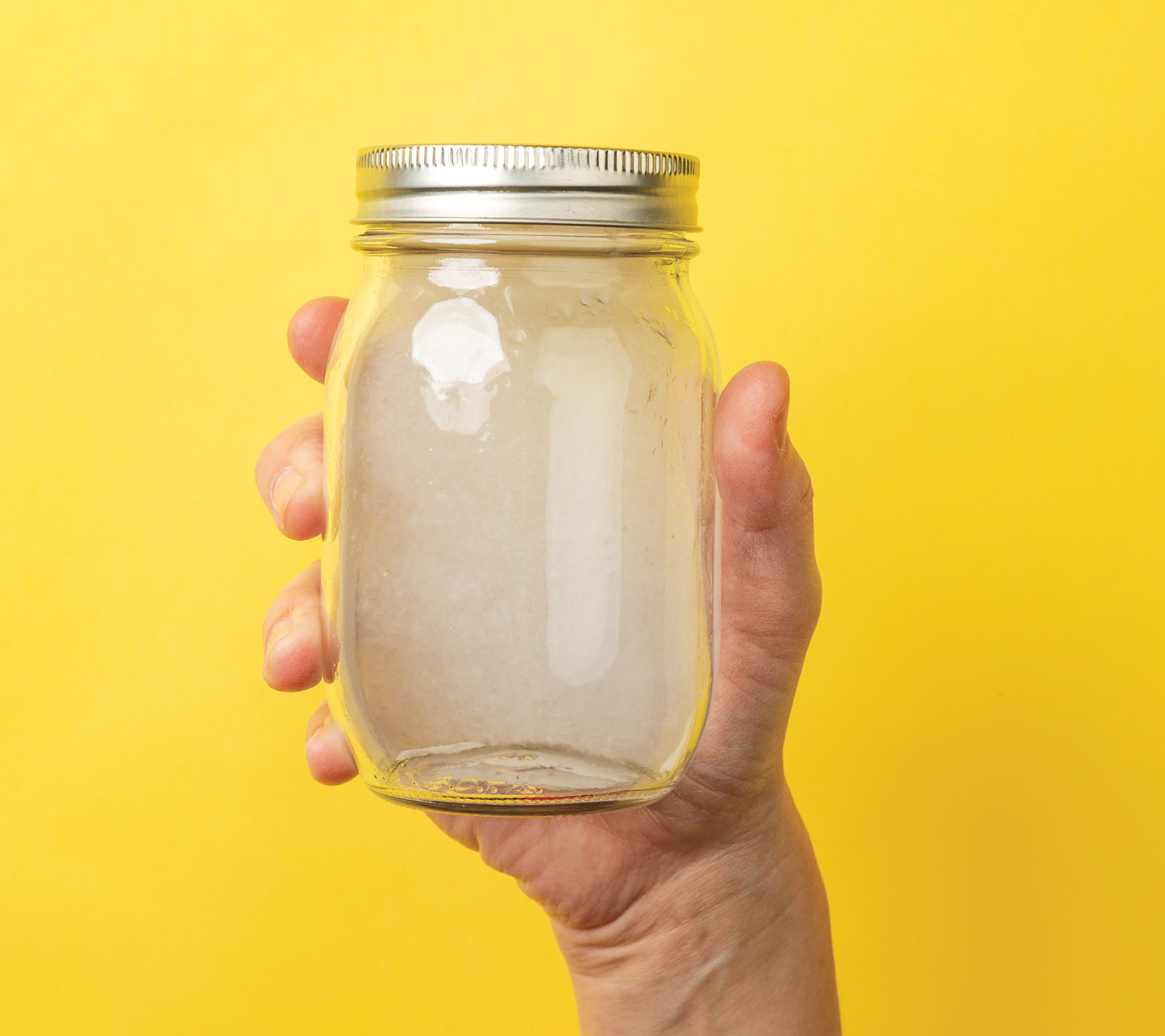 Photo of water and paper mixture in a jar.
