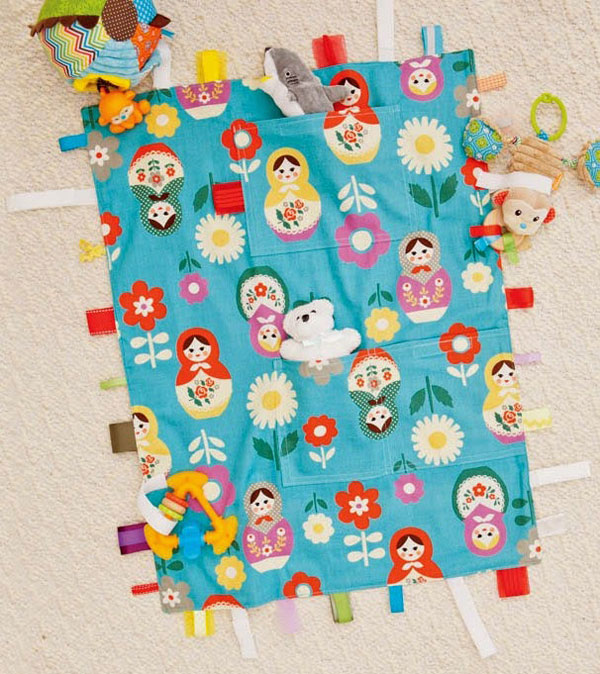 No-Toy-Left-Behind Travel Blanket, designed by Kathy Beymer. Photo © Julie Toy, excerpted from Little One-Yard Wonders.