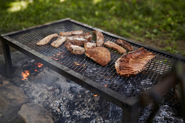 With a properly managed fire, smoking on a table grill imparts a subtle smoke level on everything from meat and poultry to fish and vegetables.