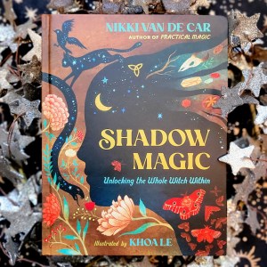Photo of "Shadow Magic" laid above starry background decor