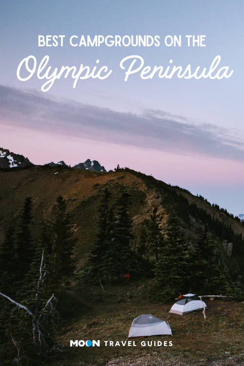 two tents on a mountain ridge at sunset