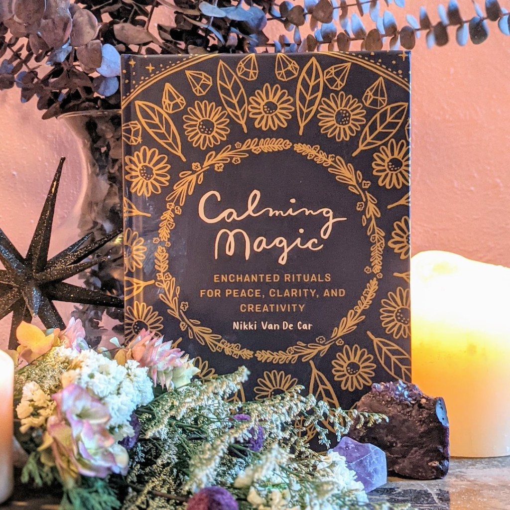 Photo of "Calming Magic" standing among floral decor