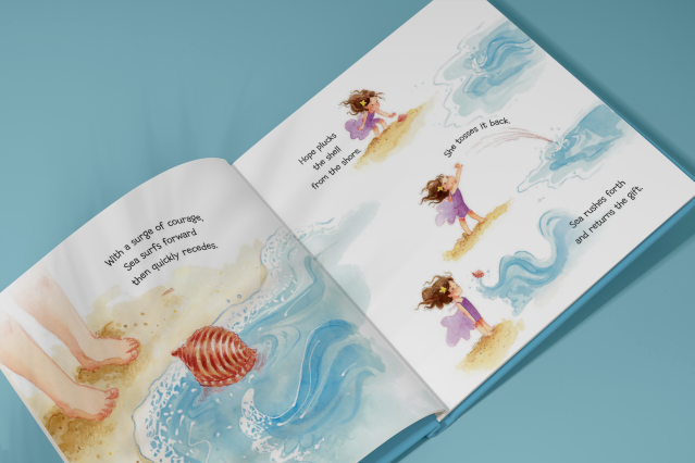 Open picture book showing watercolor illustration of child playing on a beach