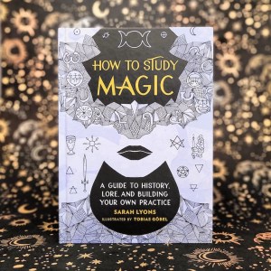 Photo of "How to Study Magic" standing against a dark starry backdrop