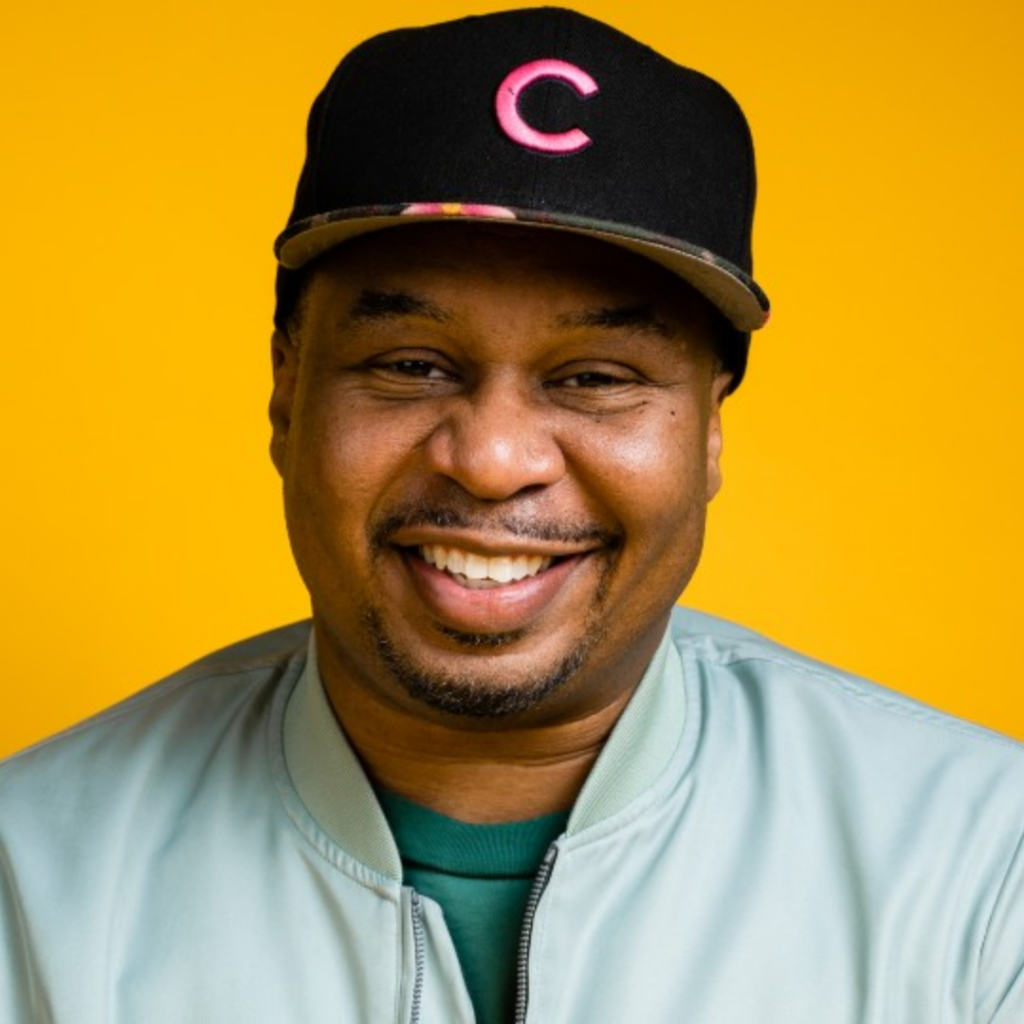Photo of Roy Wood Jr. against a yellow background