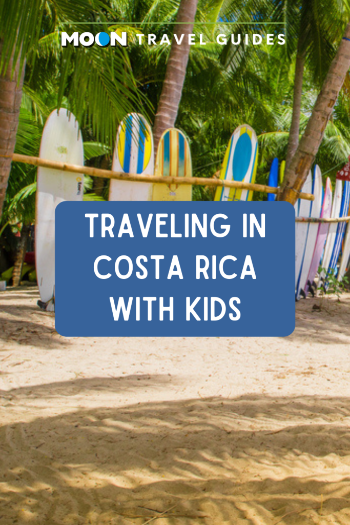 Image of surfboards on beach with text Traveling in Costa Rica with Kids