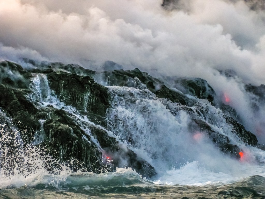 Waves crashing over the magma rocks at Hawaii Volcanoes National Park