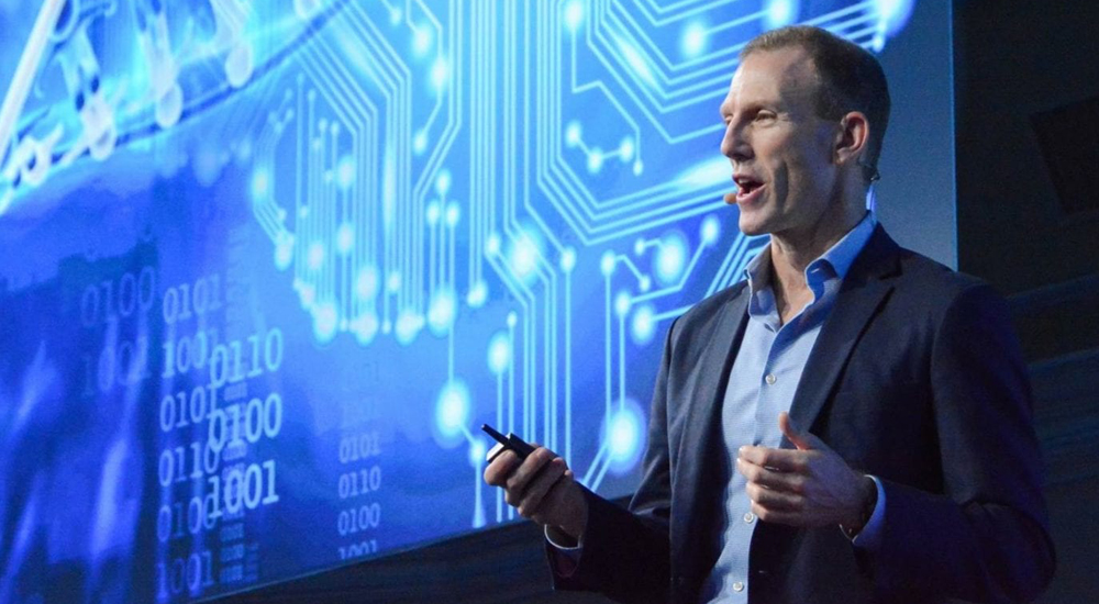 Picture of author Jamie Metzle speaking at a conference.