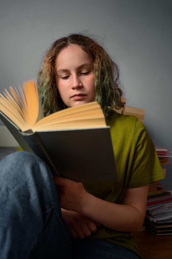 Teen reading book