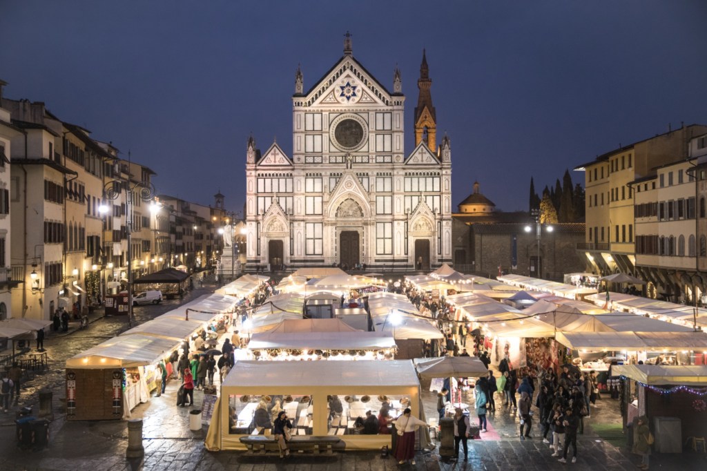 a glowing winter holiday market in Florence