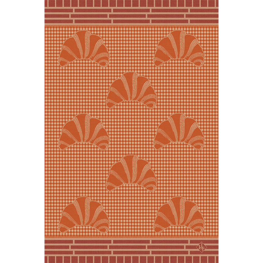 A orange and red hand towel with a pattern of croissants