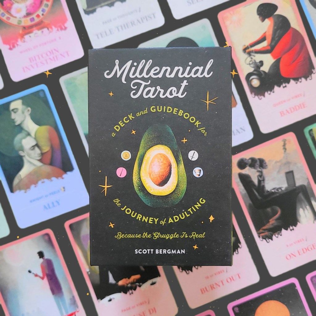 Photo of the Millennial Tarot box laid above cards from the deck