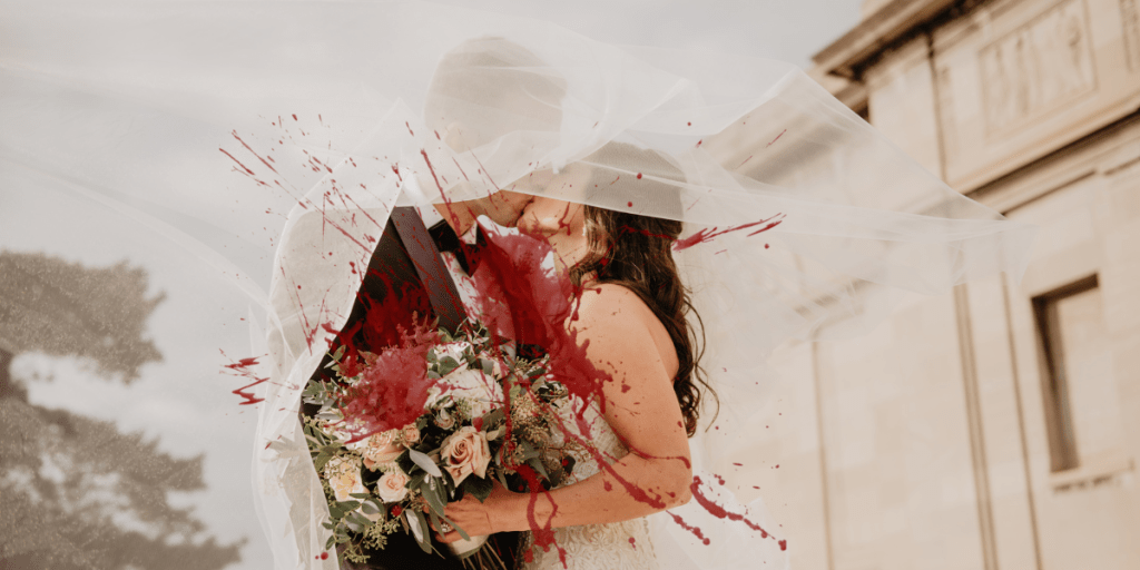 A display of a wedding gone wrong, with the bride and groom covered in blood.