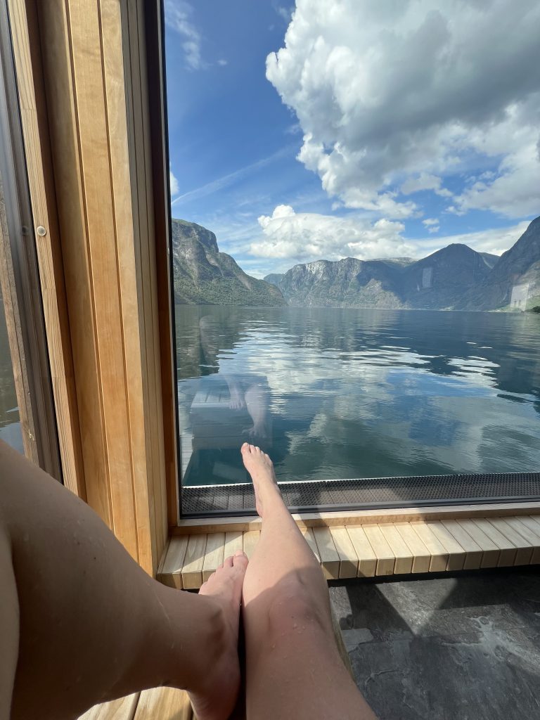 The author relaxes in a sauna floating on a fjord