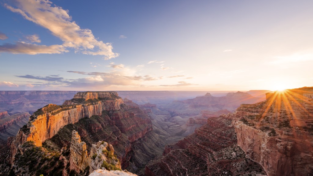sunset behind mountains in the Grand Canyon